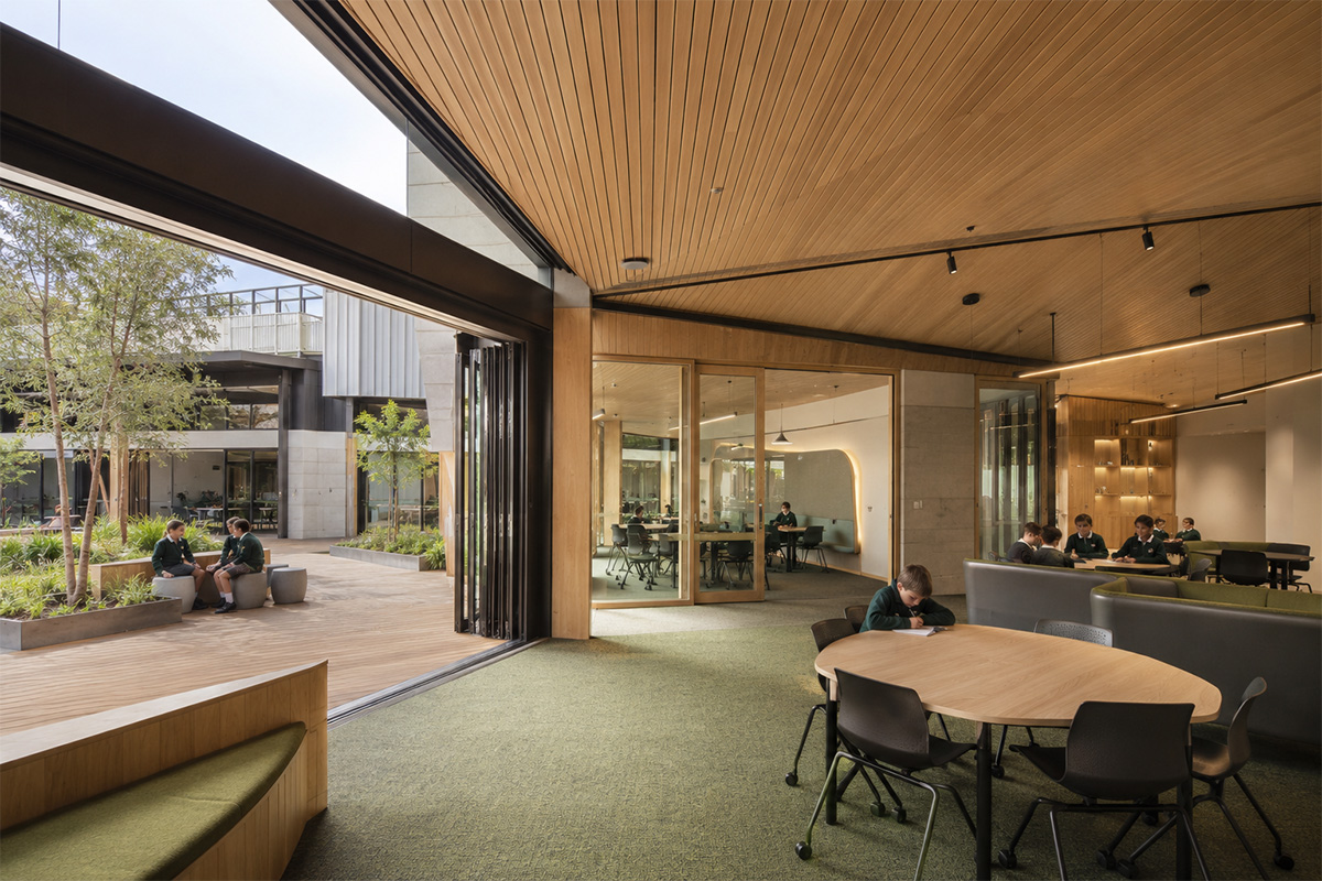 Future-ready learning environment with daylight, timber, glass, flexible education space, and subtle human scale